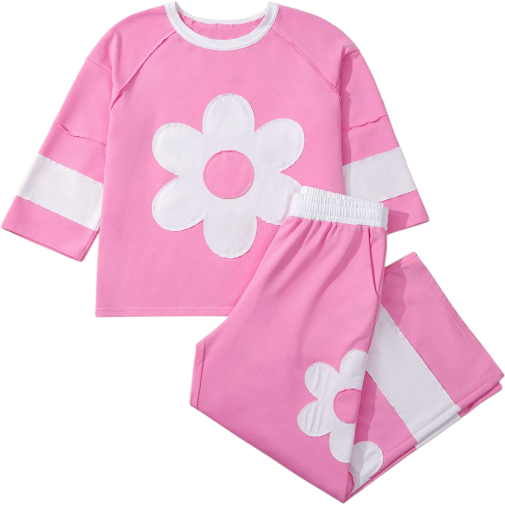 Pink children's outfit with white flower design on a white background