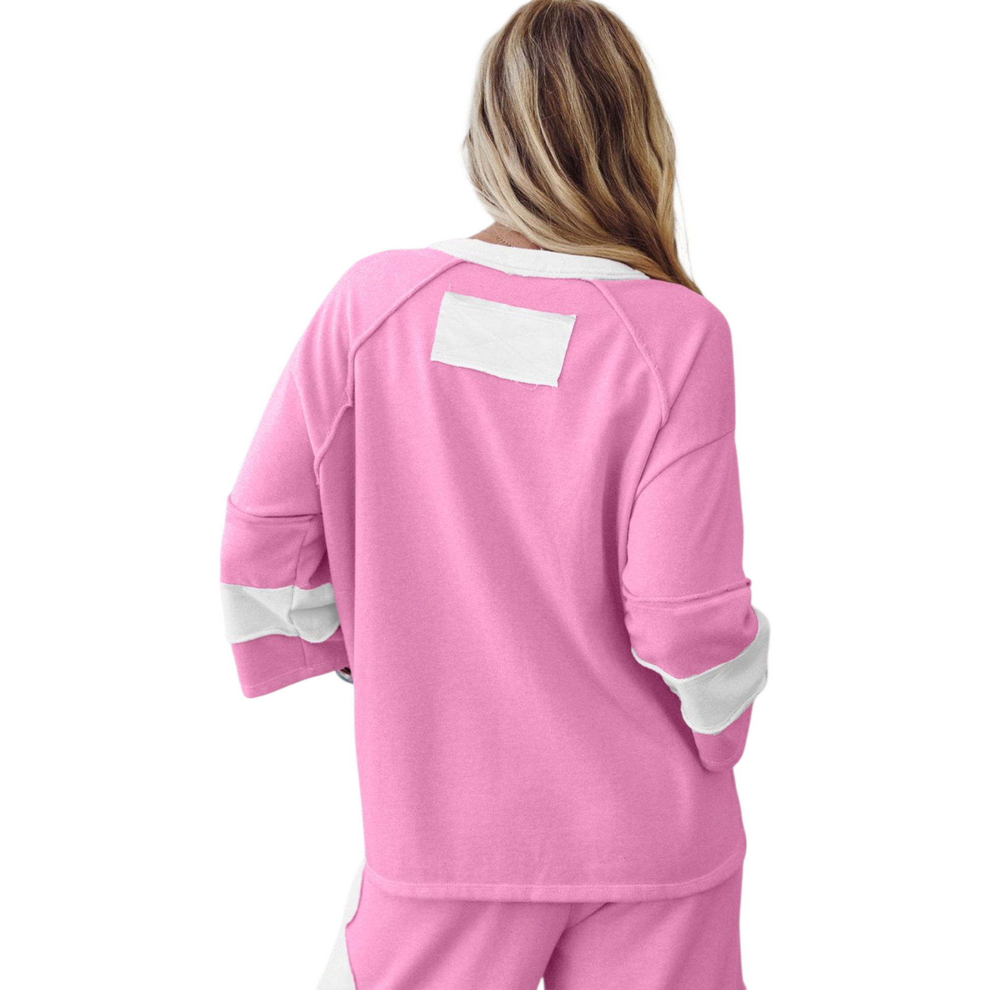 Pink pajama set with white accents on a white background