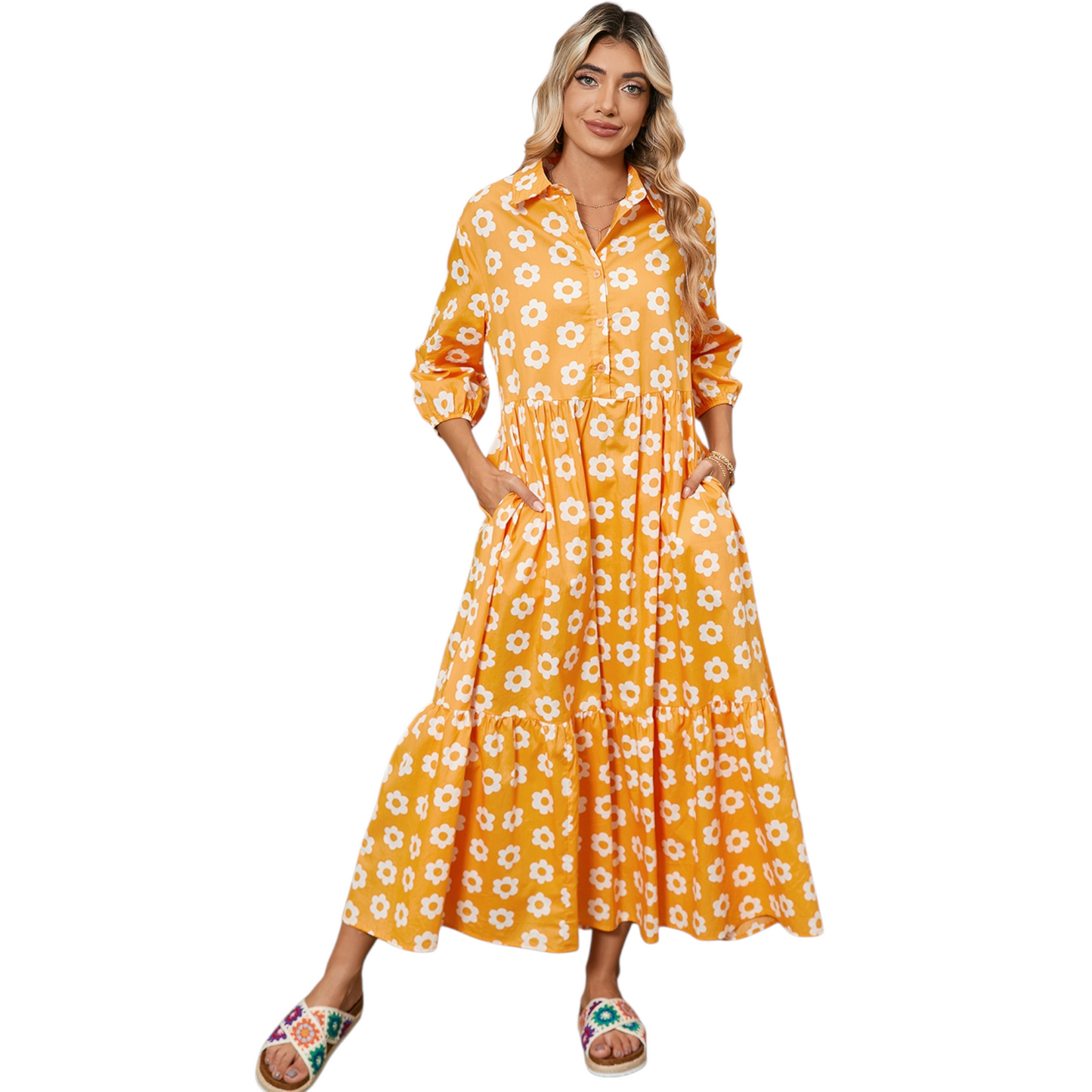 Woman wearing a yellow and white daisy print maxi dress with a collared neckline and button-down front.