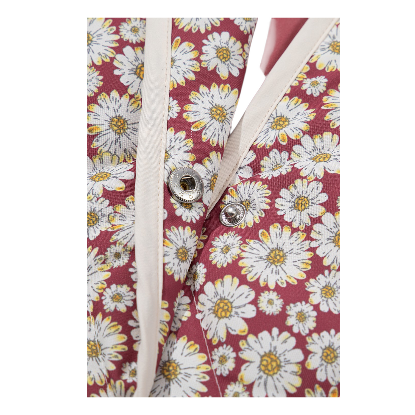 Floral-patterned fabric with white buttons on a red background