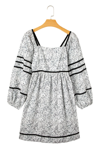 Front view of gray floral print mini dress with square neck and balloon sleeves on the white background.