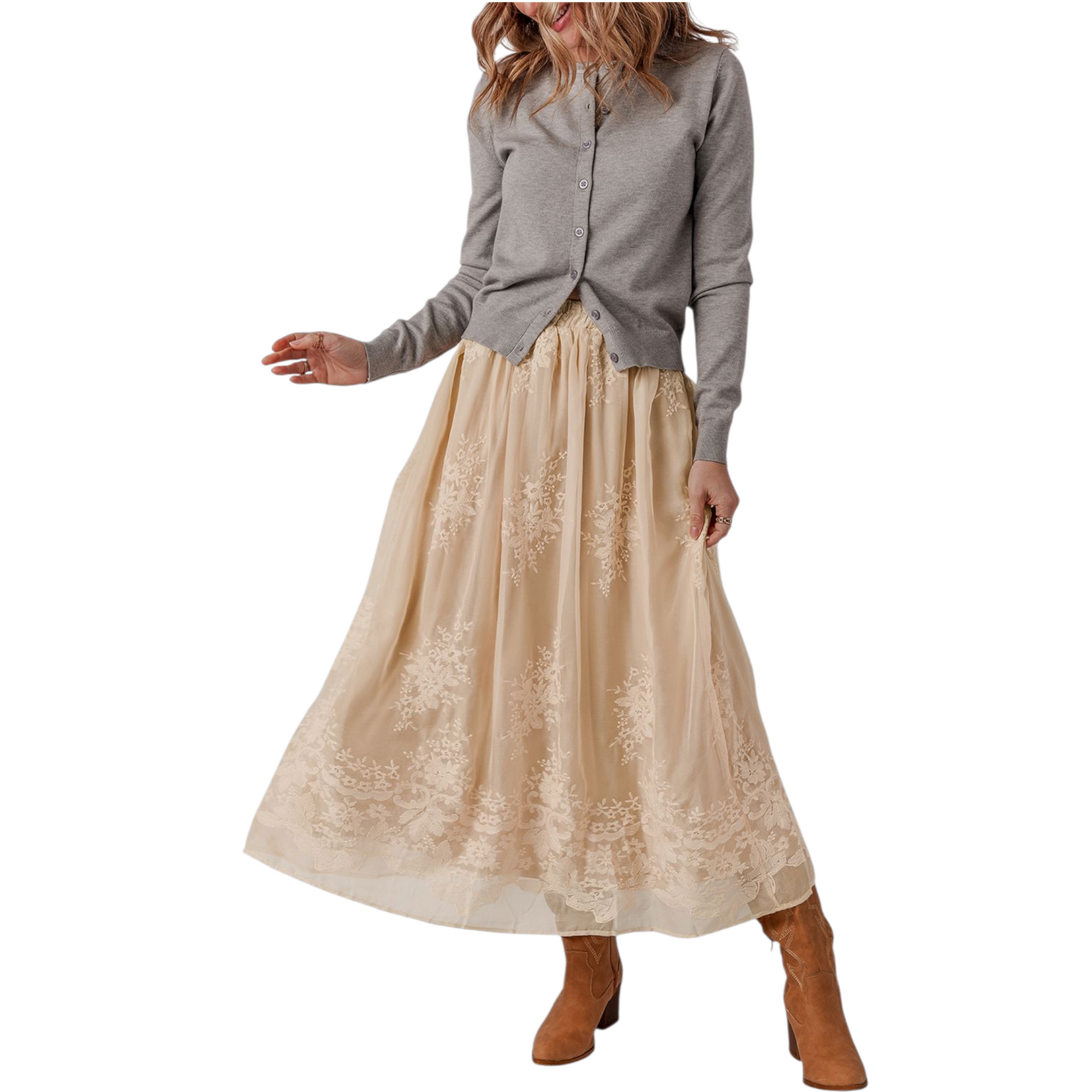 Woman wearing a gray shirt and beige lace skirt on a white background