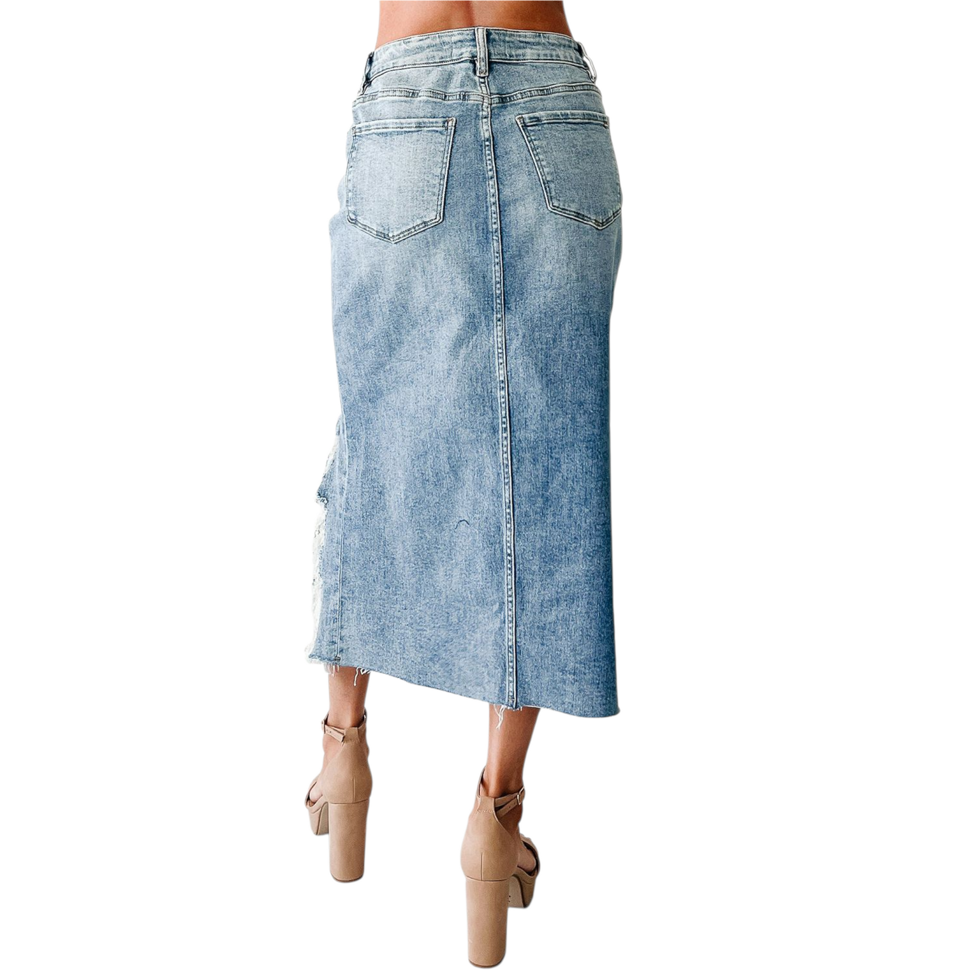 Denim skirt worn by a person on a white background