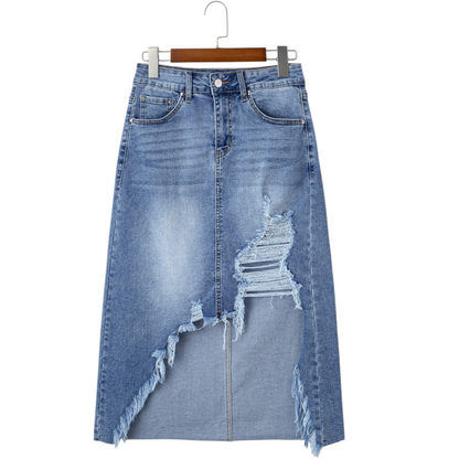 Blue denim skirt with distressed details on a white background
