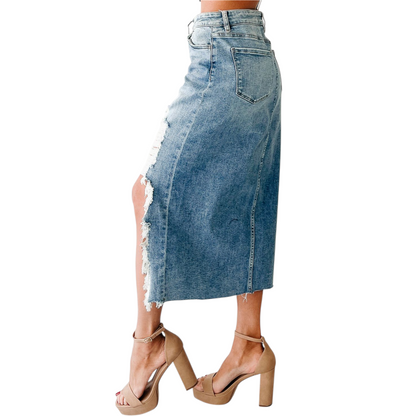 Denim skirt with frayed hem on a white background