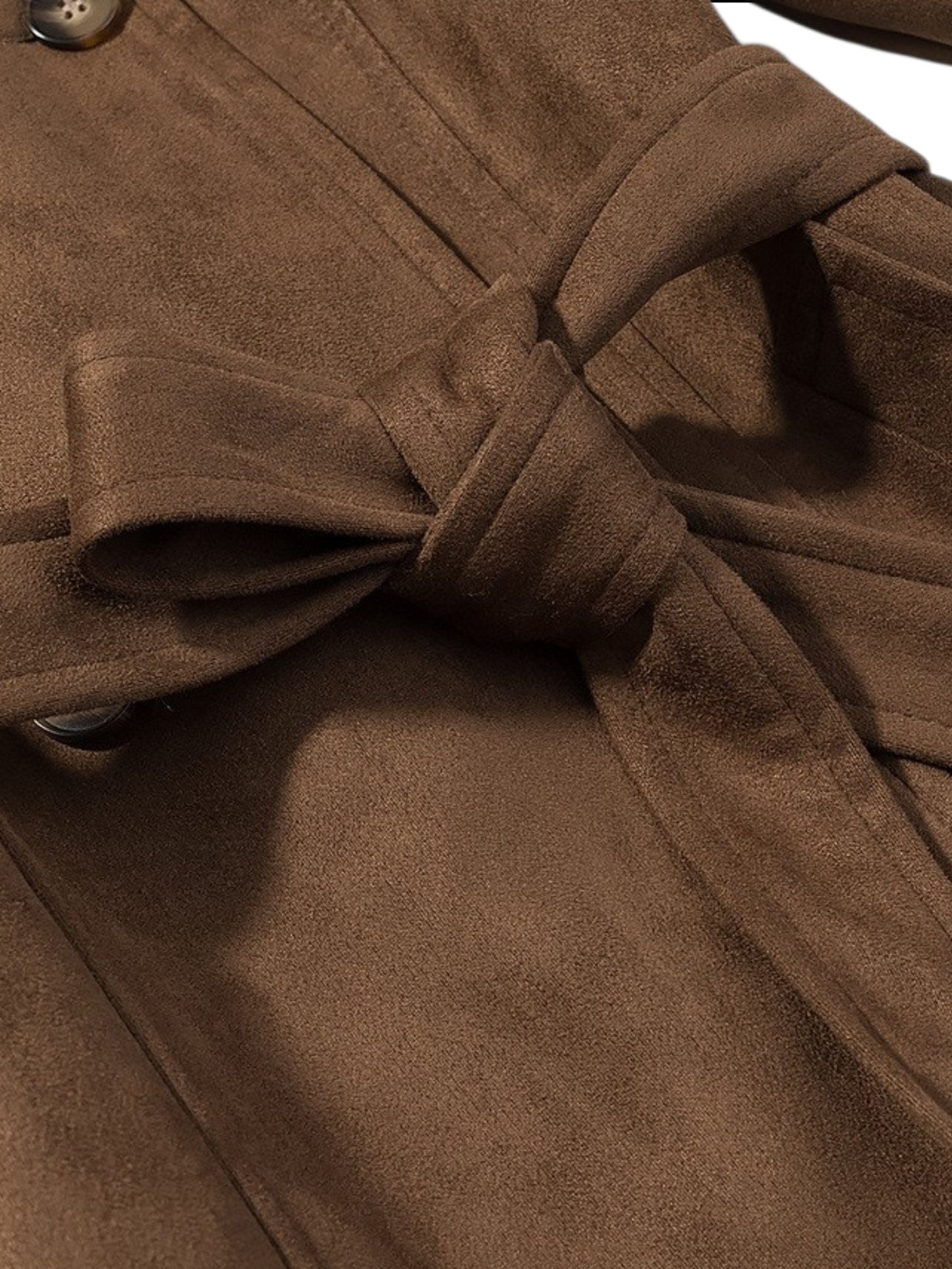 Close-up of a brown coat with a tie waist on a white background