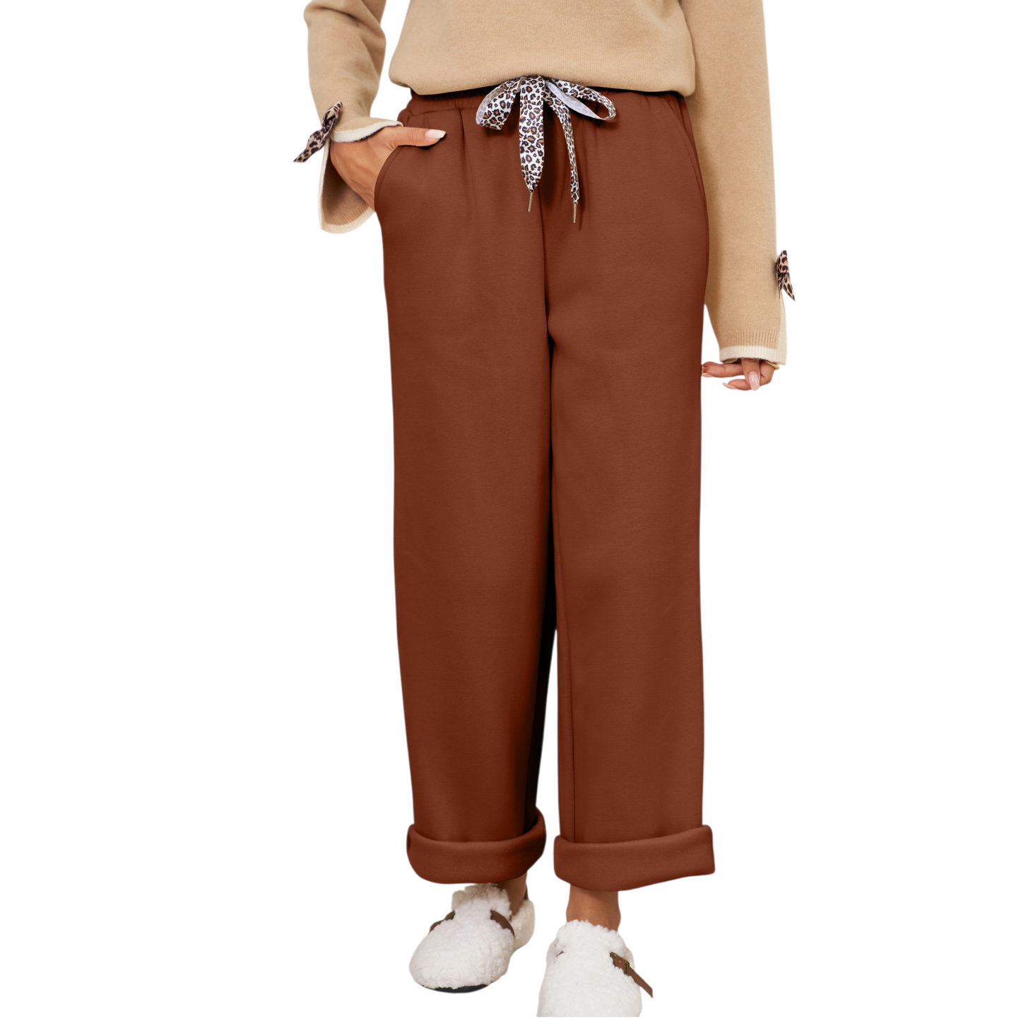 Brown wide-leg pants worn by a person on a white background