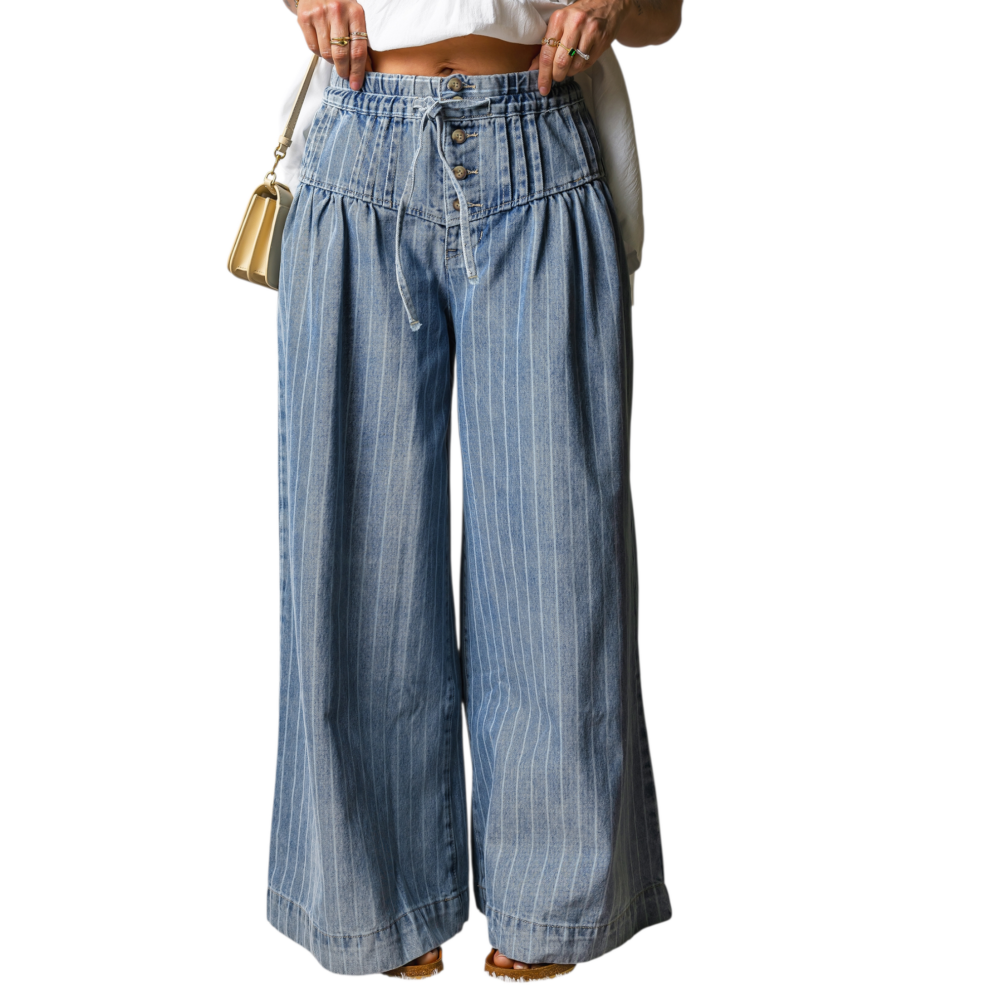 Wide-leg denim pants worn by a person on a white background