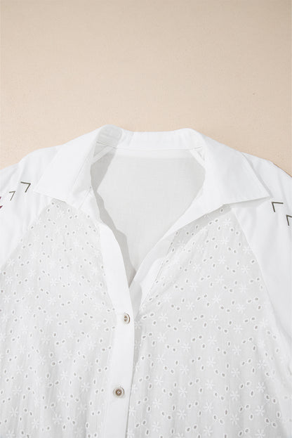 A close-up view of the white embroidered long sleeve shirt highlights its front collar design and button details.