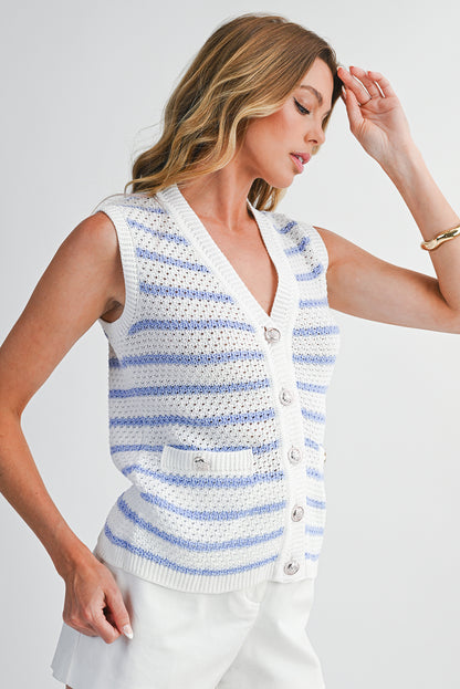 Woman wearing a white and blue striped sleeveless crochet top on a light gray background