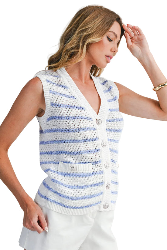 Woman wearing a white and blue striped sleeveless crochet top on a light gray background