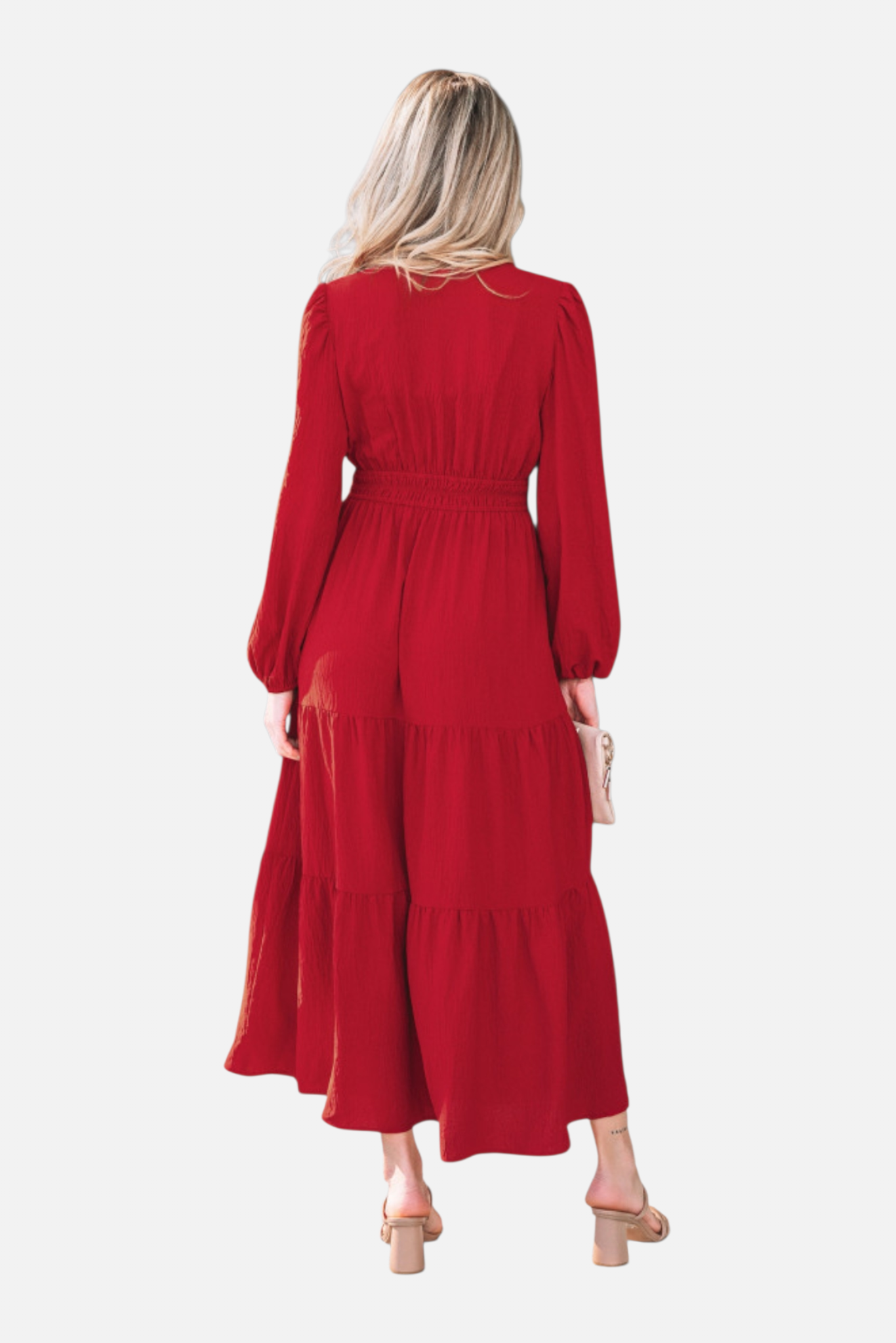 Rear view of the long-sleeved burgundy maxi dress showcasing the elasticated smocked waist and the romantic volume of the tiered skirt.