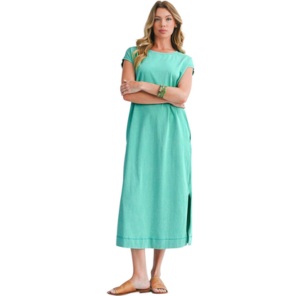 Woman wearing a teal dress on a white background