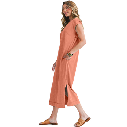 Woman wearing a peach-colored dress on a white background