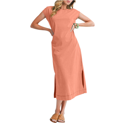 Woman wearing a peach-colored dress on a white background