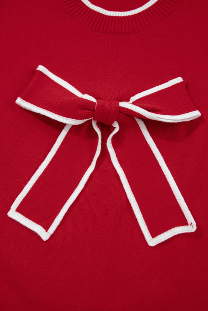 Red sweater with a large white bow detail