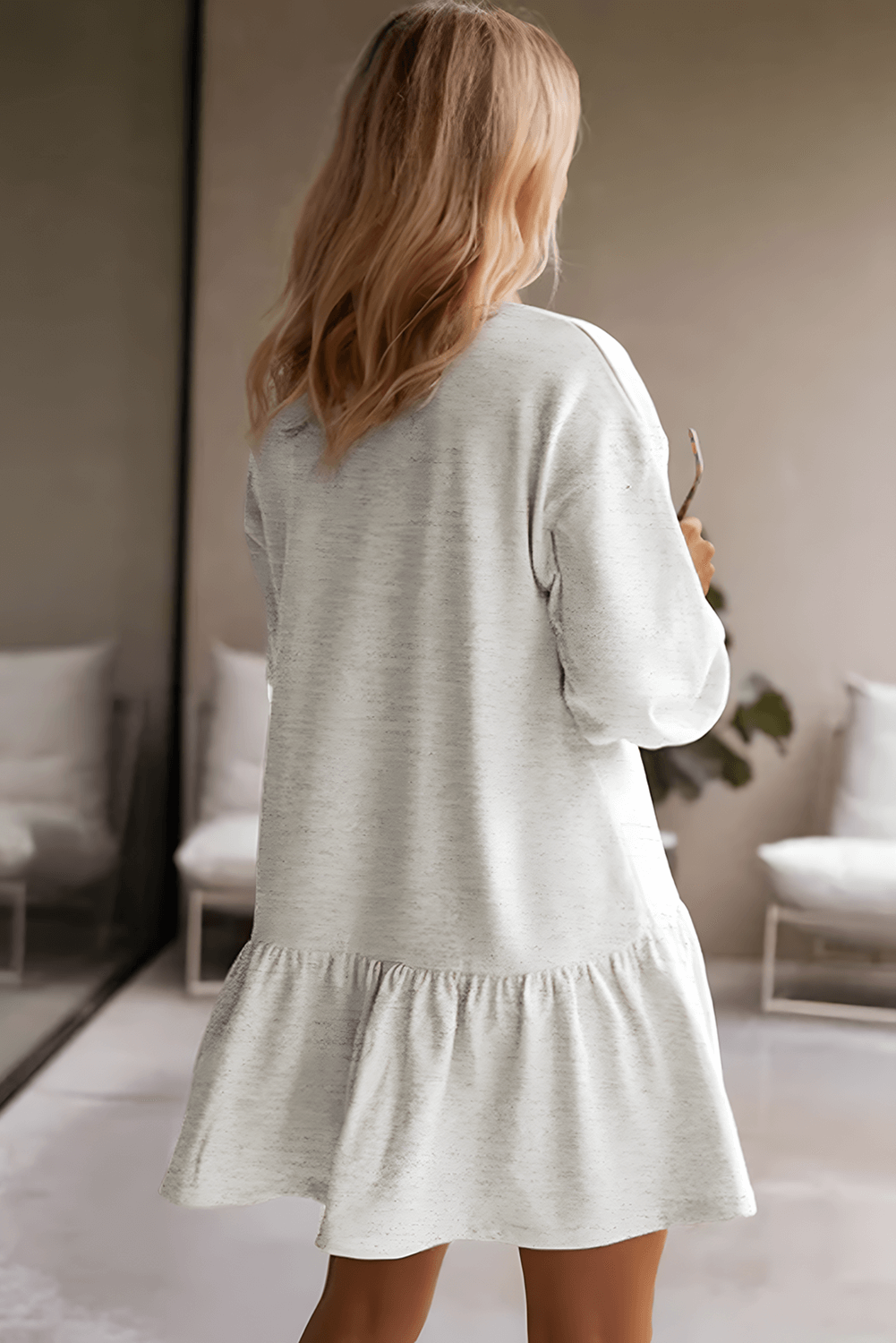 Back view of the dress, highlighting the relaxed fit and sweatshirt-inspired design.