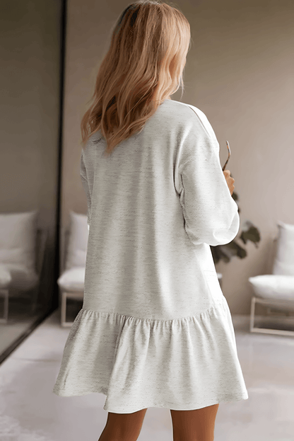 Back view of the dress, highlighting the relaxed fit and sweatshirt-inspired design.