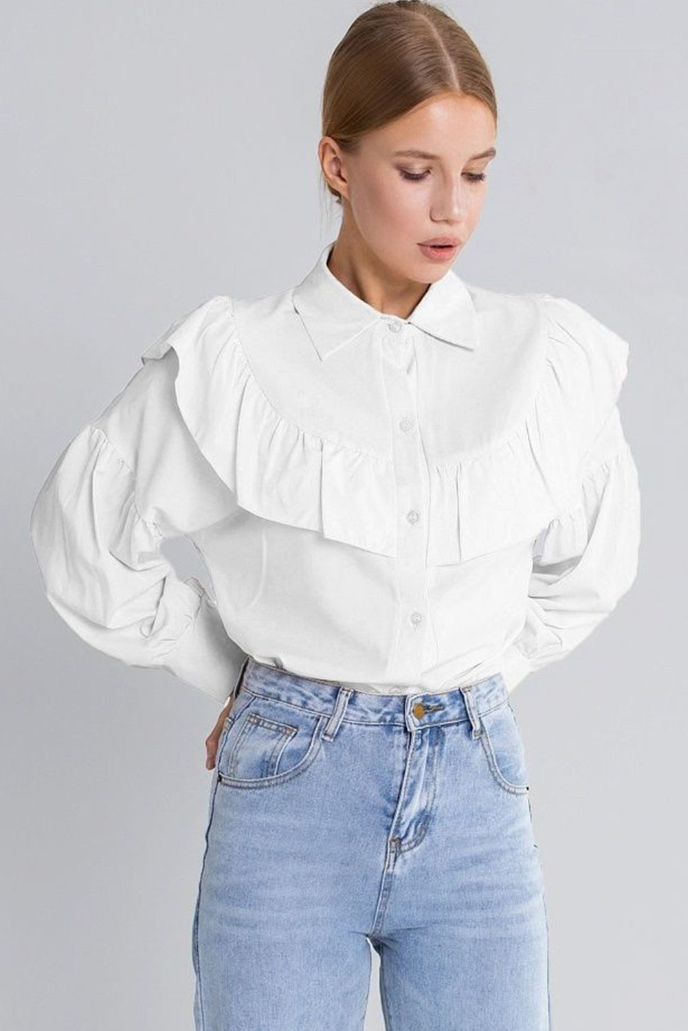 The front view of long sleeve  white shirt featuring ruffle chest,  this stylish shirt can be worn in spring and summer seasons.