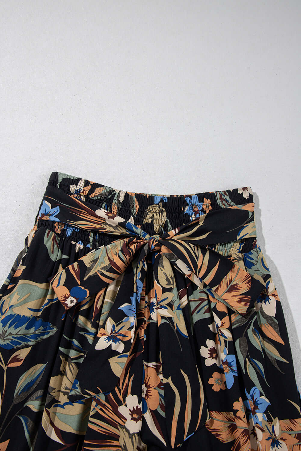 Chic floral wide-leg pants styled with sandals for an easygoing Australian beach look.