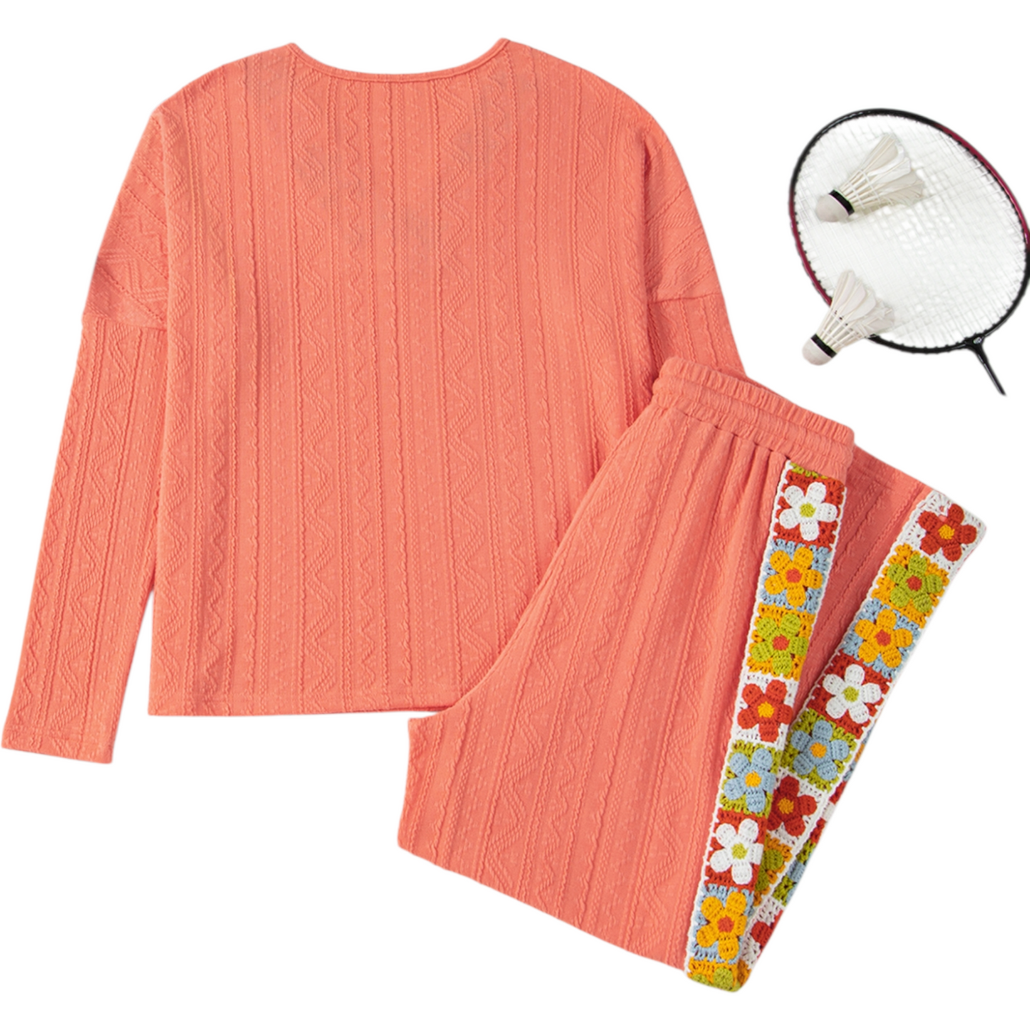 Coral outfit with floral accents, badminton racket on a white background