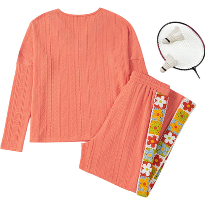Coral outfit with floral accents, badminton racket on a white background