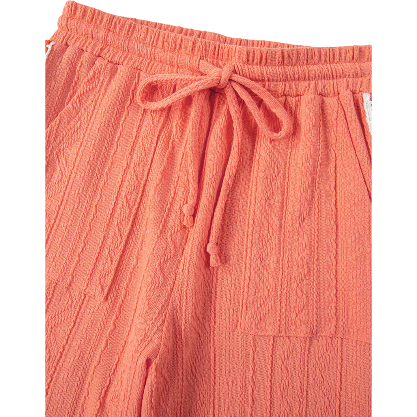 Coral-colored pants with a drawstring on a white background