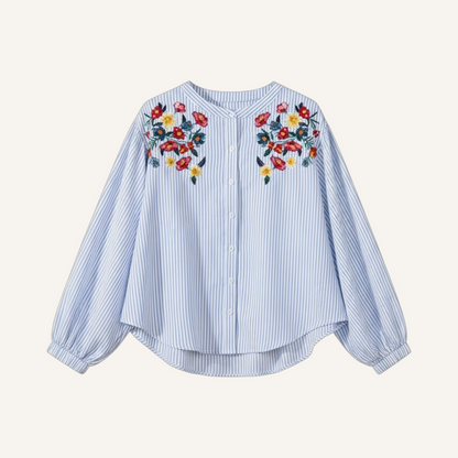 Blue striped balloon sleeve tunic featuring vibrant red and yellow floral embroidery on the shoulders and a button front.