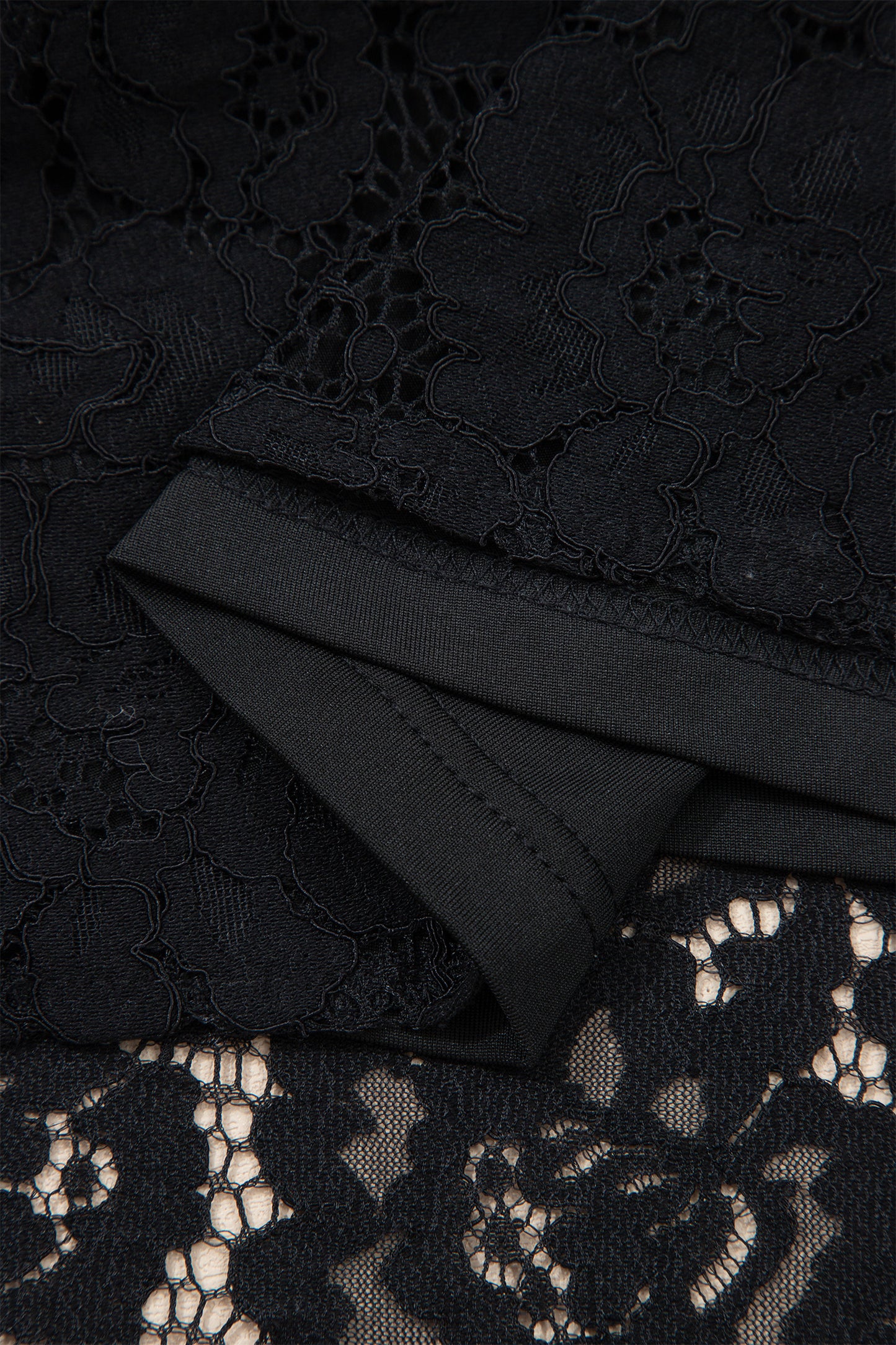 Close-up of black lace fabric with floral patterns