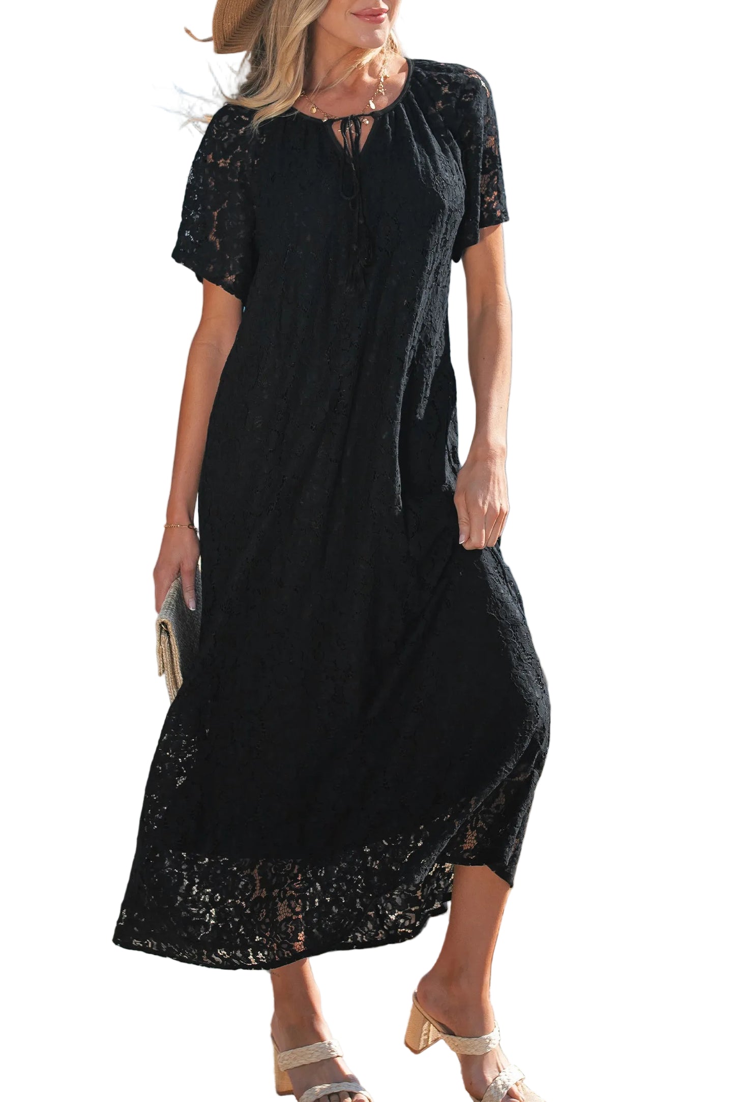 Black lace dress worn by a model on a white background