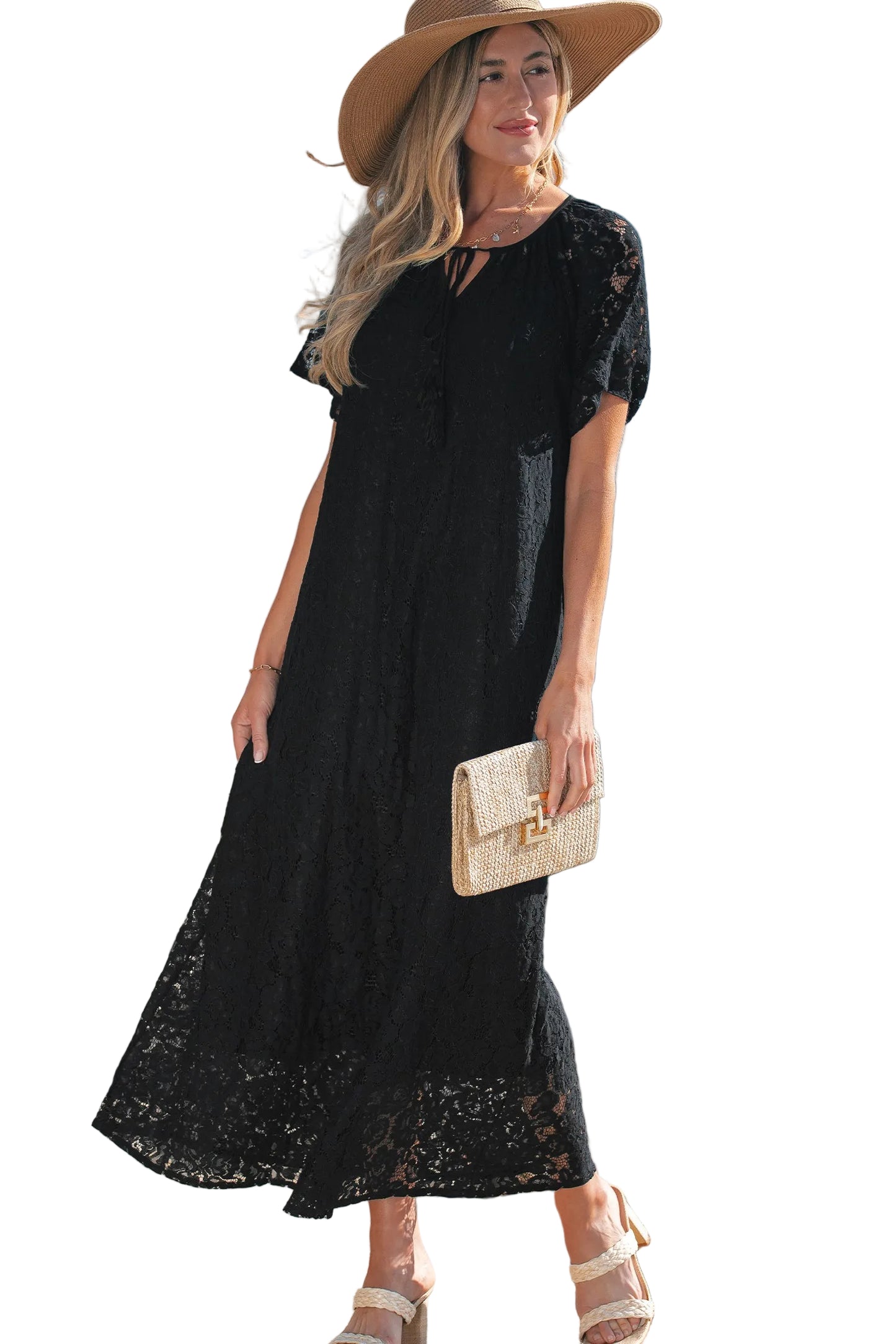 Woman wearing a black lace dress with a beige hat and clutch on a white background