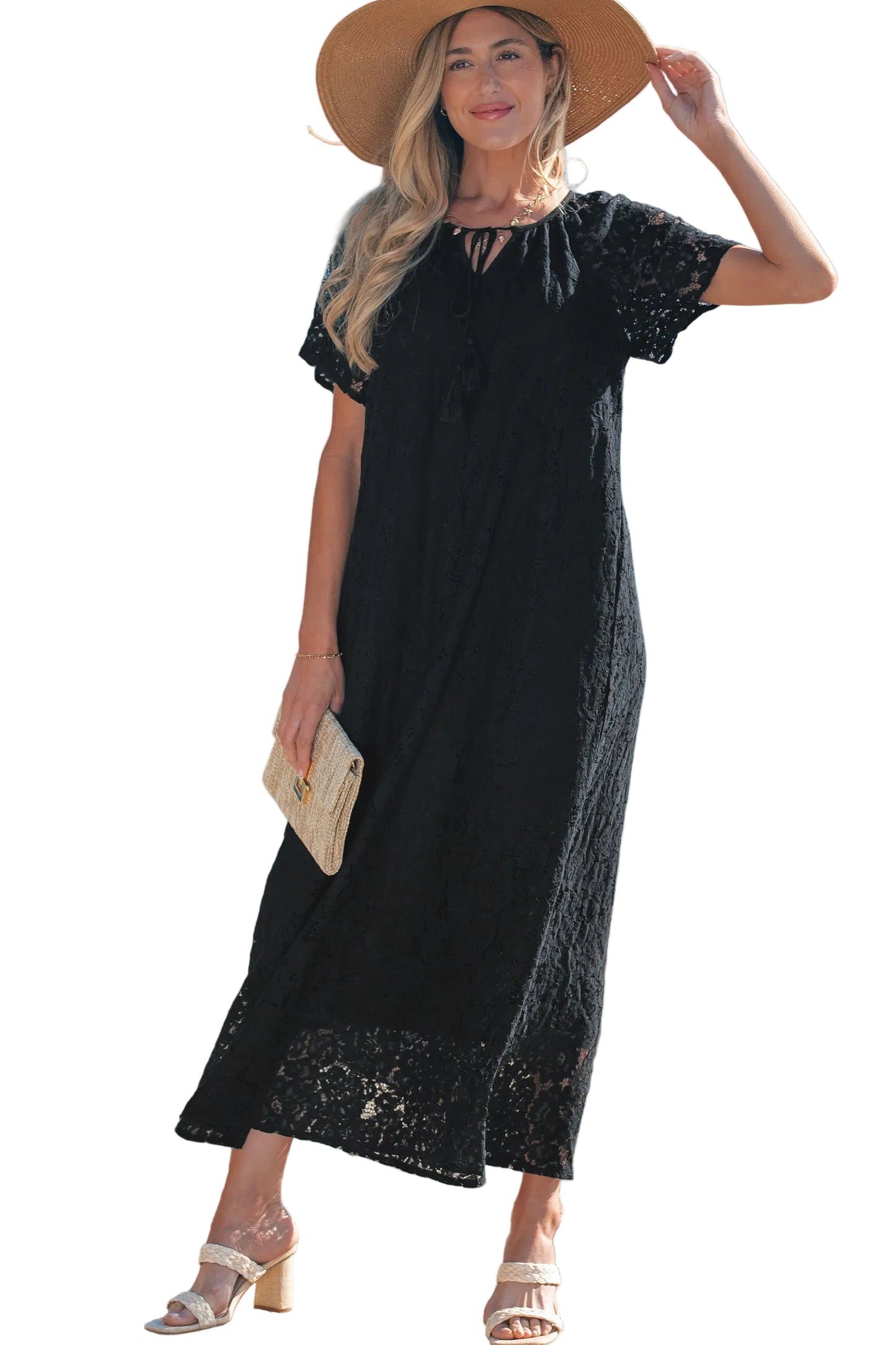 Woman wearing a black dress with lace details on a white background