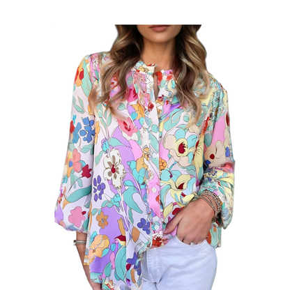 Woman wearing a colorful floral blouse with a white background