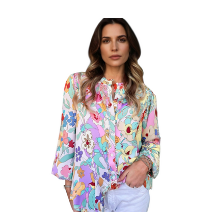 Woman wearing a colorful floral blouse on a white background