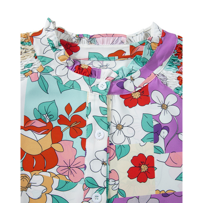 Colorful floral-patterned fabric with a collar on a white background