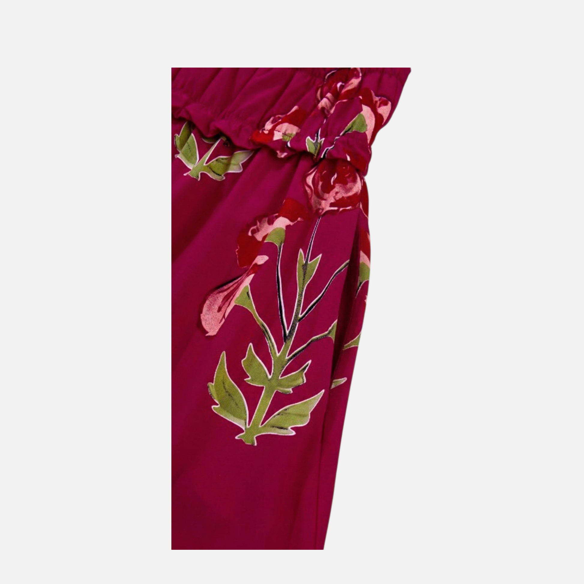 Close-up detail of the discreet side seam pocket on a fuchsia floral print tiered maxi dress.
