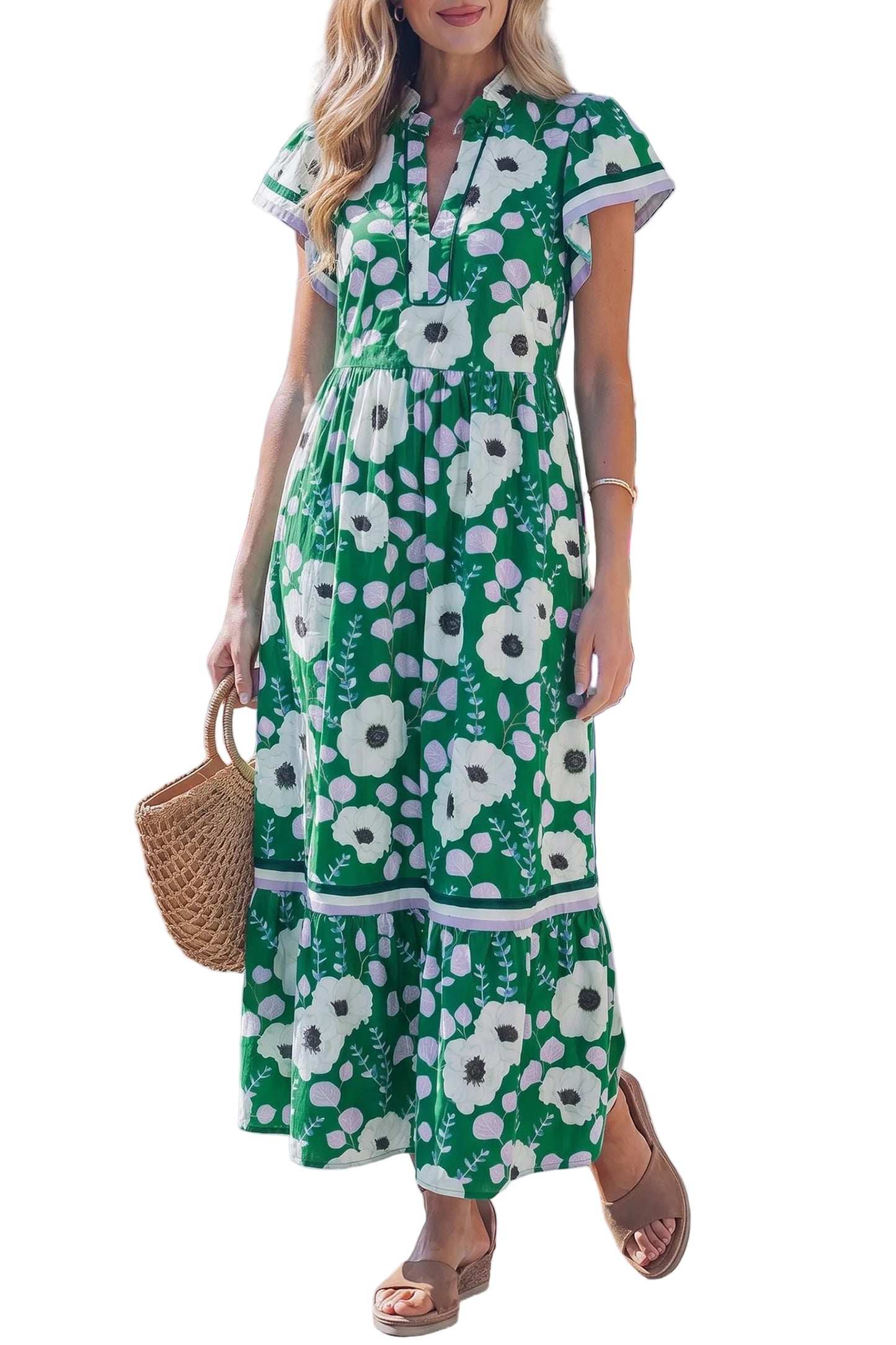 Front view of a woman wearing a green floral dress with short flutter sleeves and V-neckline standing against a white background