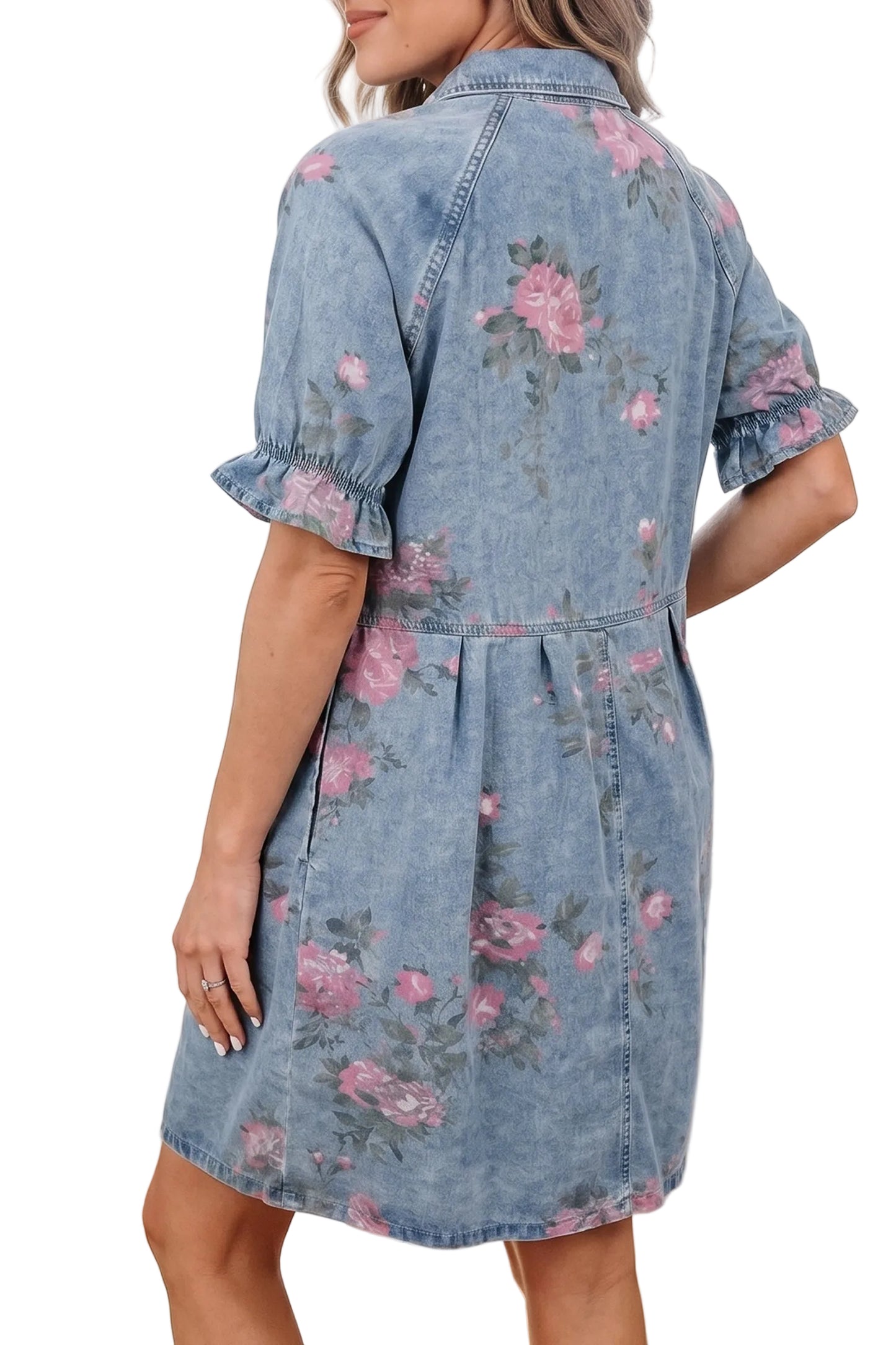 Rear three-quarter view of the model showcasing the western yoke paneling and gathered elastic ruffle cuffs on the floral denim dress.