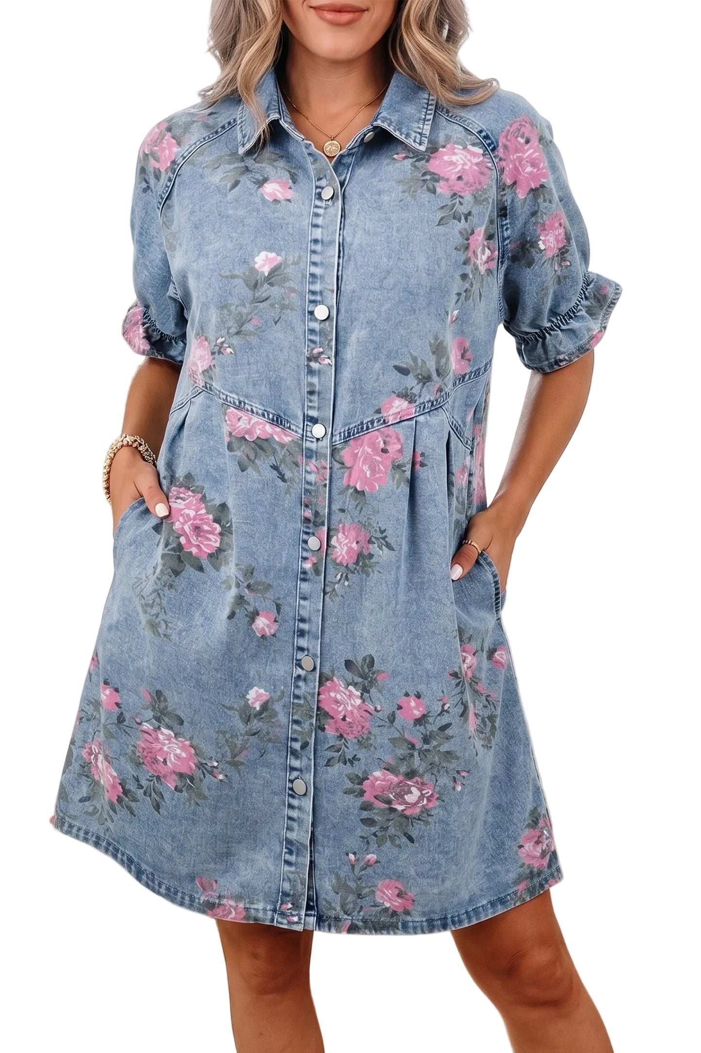 Front view of a model wearing a washed blue denim mini shirt dress featuring a pink rose print, button front, and side pockets.