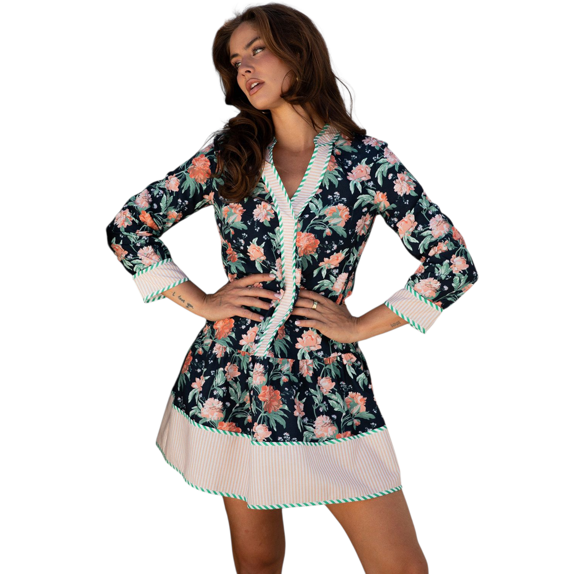 Woman wearing a floral dress with a white border on a white background