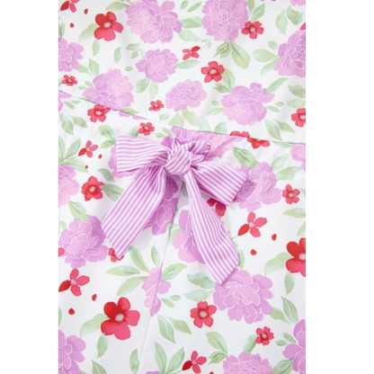 Floral print mini dress with a ruffle neck and pockets. Bow detailing.