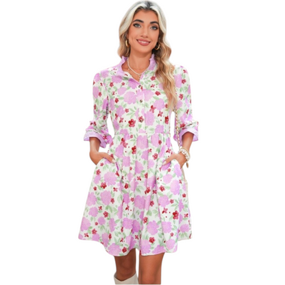 Floral print mini dress with a ruffle neck and pockets.