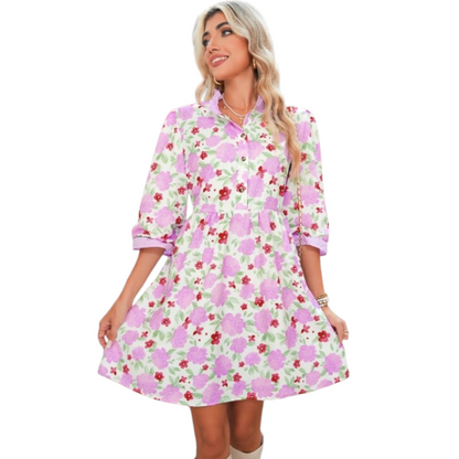 Floral print mini dress with a ruffle neck and pockets.