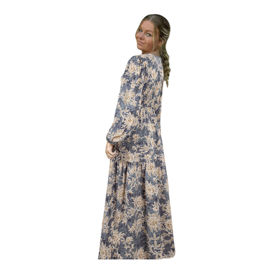 Woman wearing a floral dress on a white background