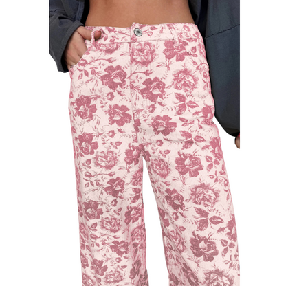 Front close-up view of women’s straight-leg denim jeans featuring a pink and cream vintage floral rose print and an ankle-length hem.