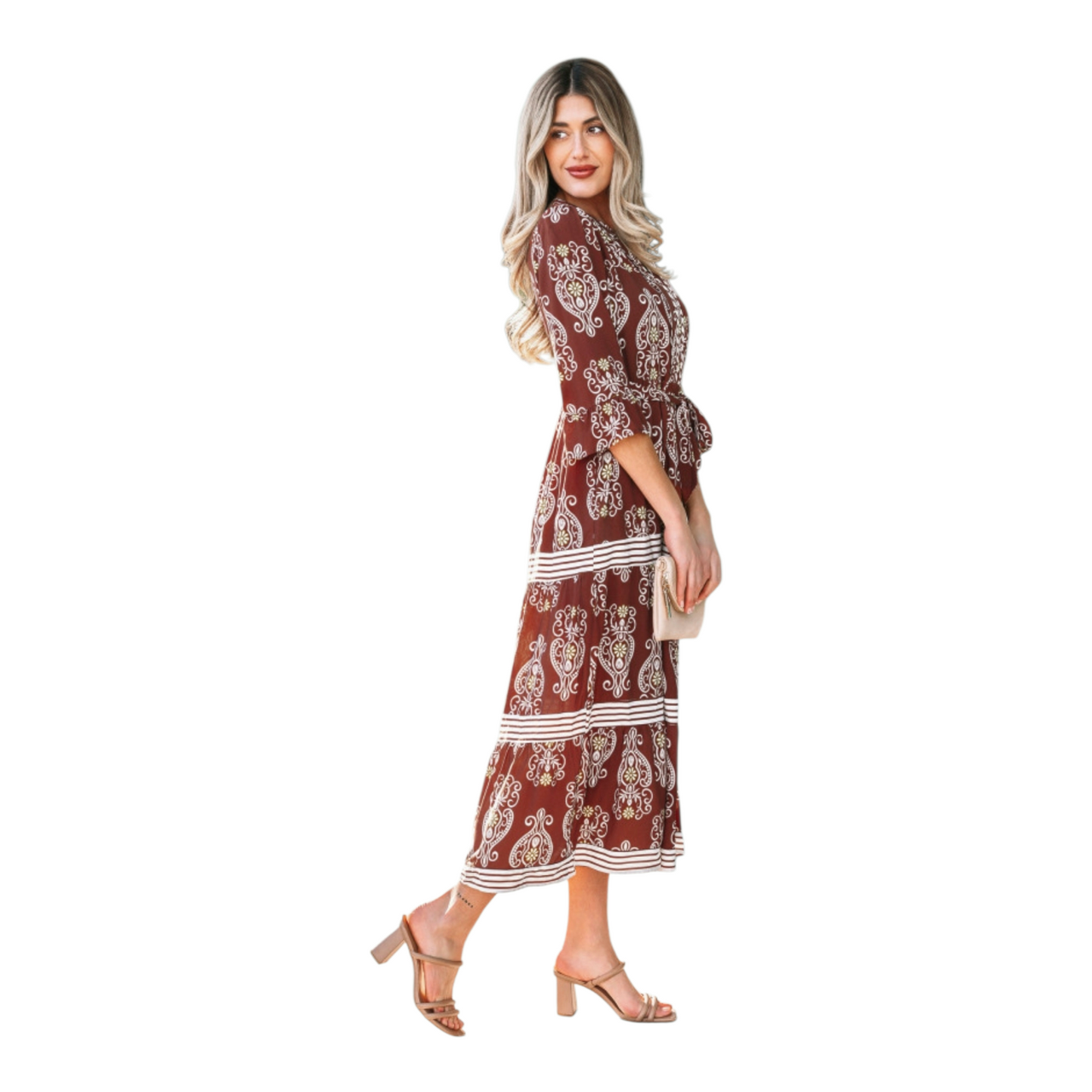 Woman wearing a rust-brown paisley floral maxi dress with a matching waist tie belt and flutter sleeves.