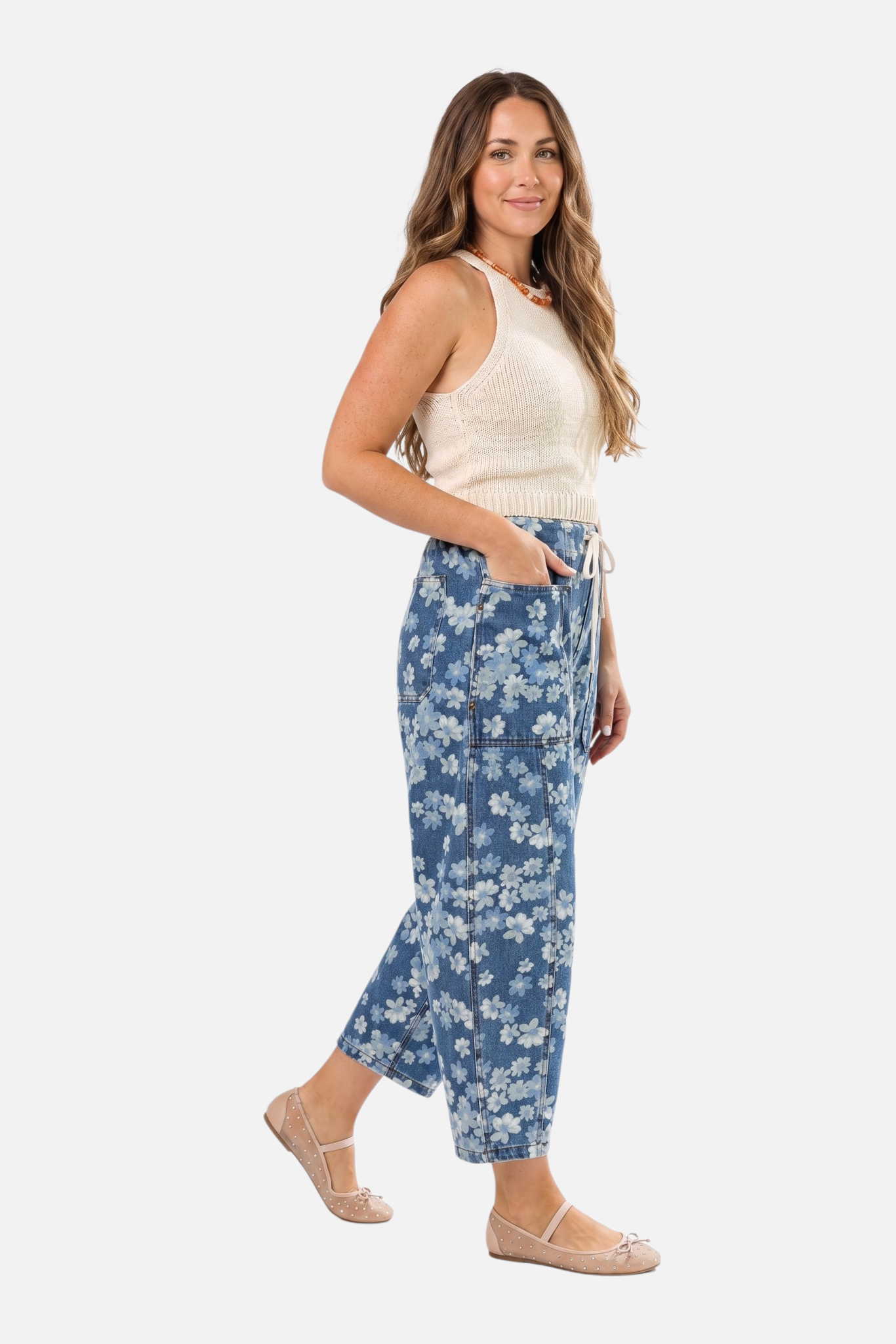 Side profile of the floral wide-leg denim jeans showcasing the modern barrel silhouette, spacious front patch pockets, and breathable cotton-blend fabric.