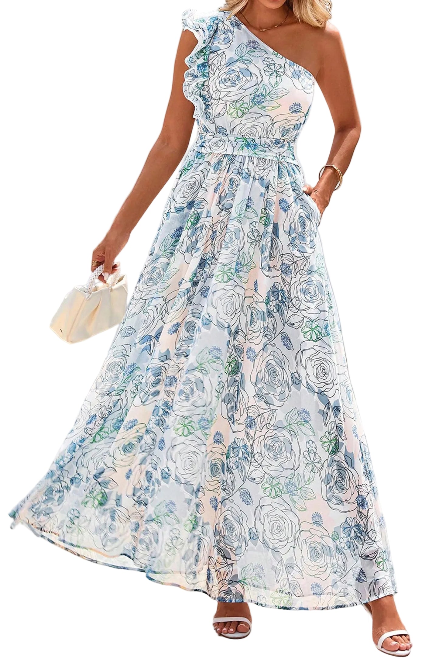 Woman wearing a floral one-shoulder dress against a white wall.
