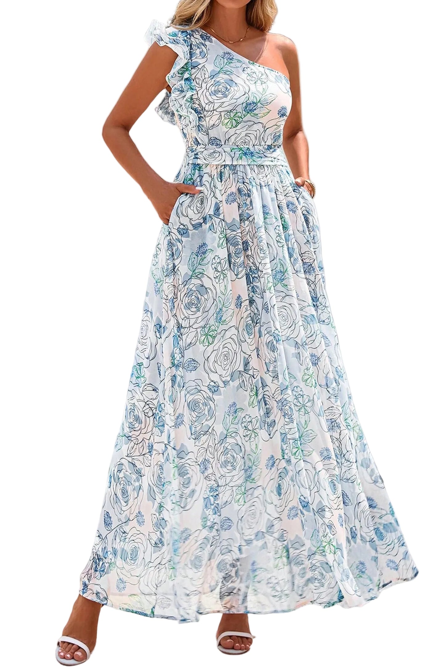 Woman wearing a floral one-shoulder dress against a white wall.