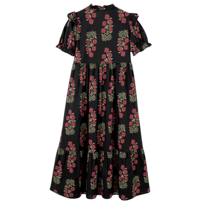 Back view of a black and pink floral cotton midi dress with puff sleeves and a tiered ruffle hem.